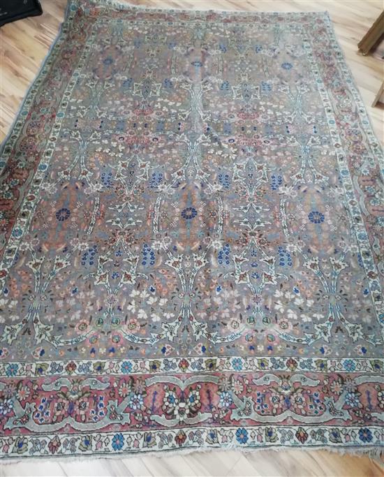 A Persian indigo ground carpet 330 x 230cm approx.